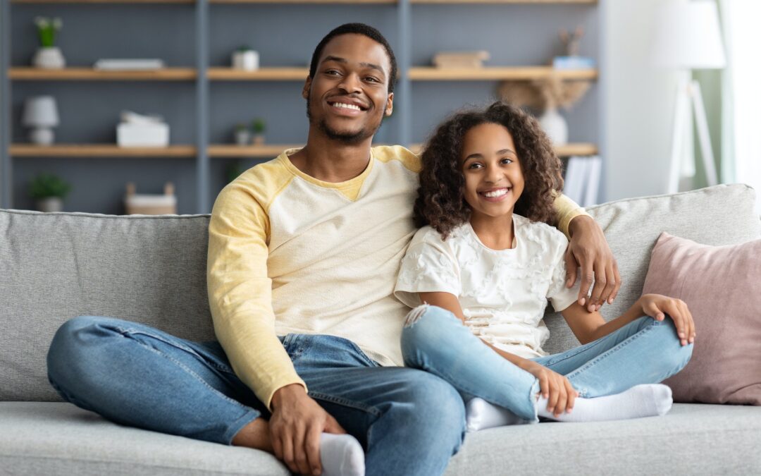 Happy african american family kid and dad spending time together